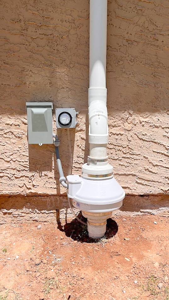 Radon system installed on exterior of arizona home.