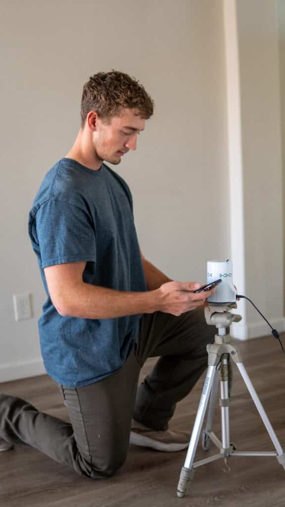 Setting up radon monitoring device in arizona home.